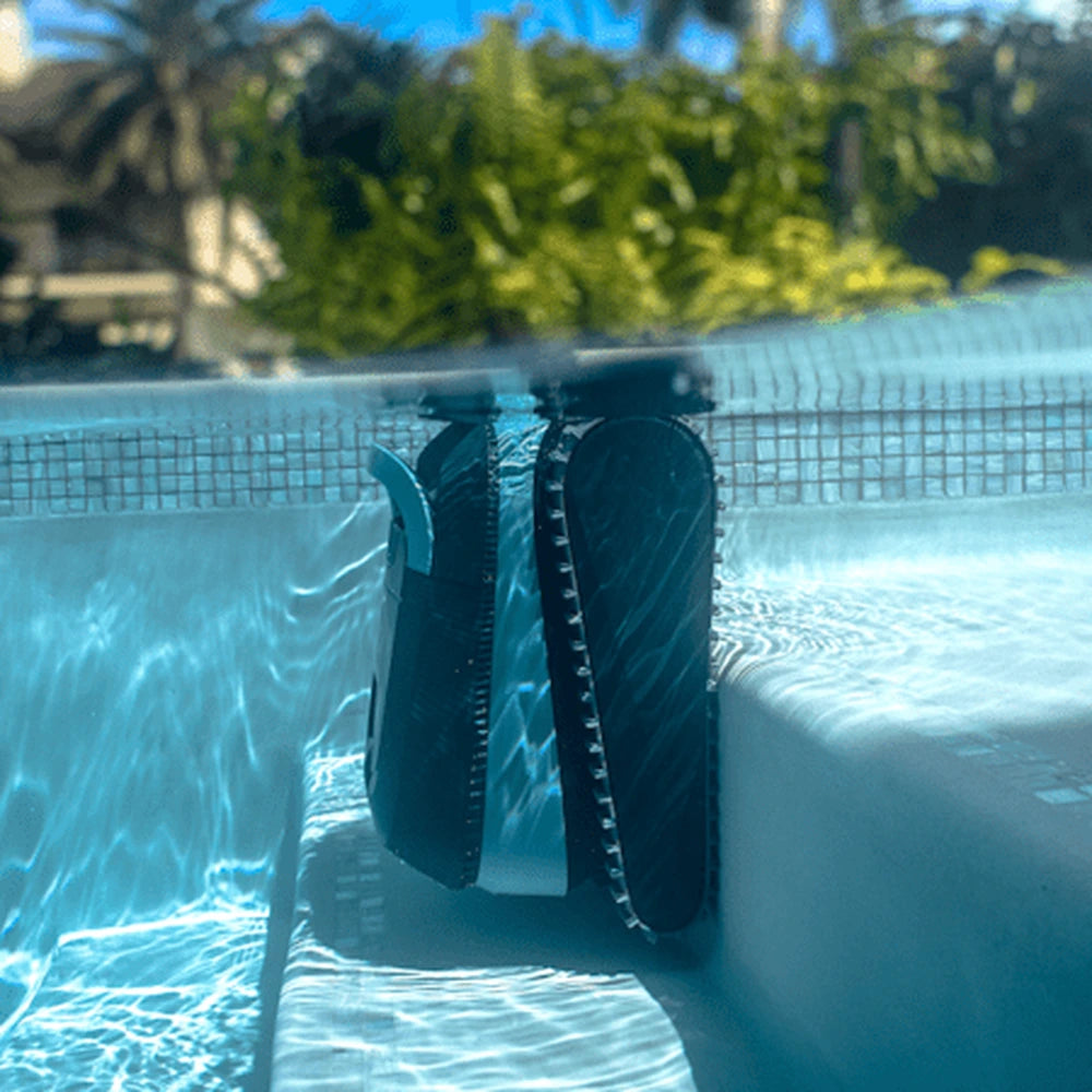 Dolphin Eon 120d robotic pool cleaner underwater at the pool wall beside the steps