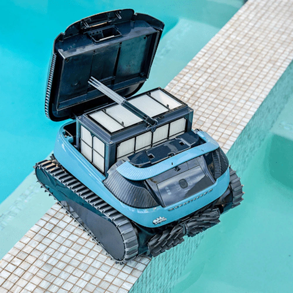 Dolphin Eon 120d on the pool edge with the top lid open showing the backwash filter cartridges